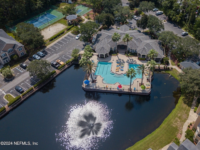 birds eye view of property with a water view