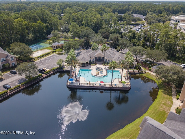 aerial view featuring a water view and a view of trees