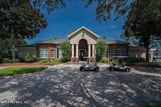 mediterranean / spanish-style home featuring stucco siding