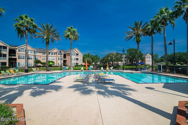 view of swimming pool featuring a patio area