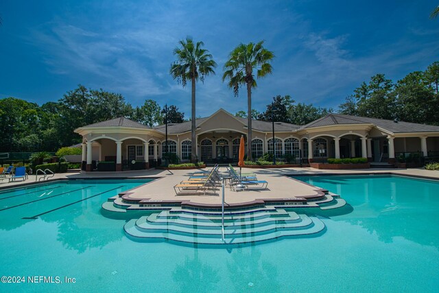 view of swimming pool with a patio area