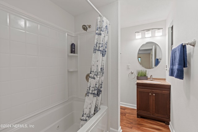 bathroom with vanity, wood-type flooring, and shower / bath combo