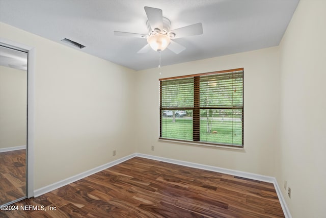 spare room with ceiling fan and hardwood / wood-style flooring