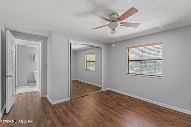 unfurnished bedroom with ceiling fan, hardwood / wood-style flooring, and a closet