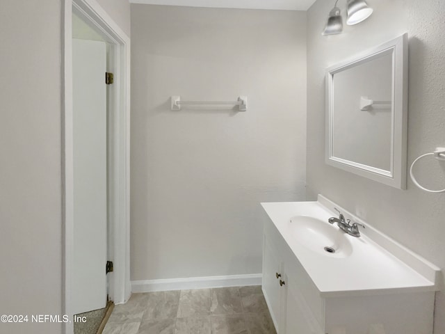 bathroom with vanity and tile patterned flooring