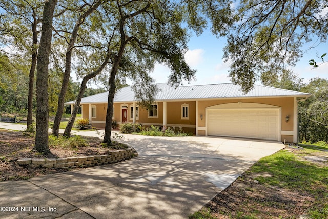 single story home with a garage