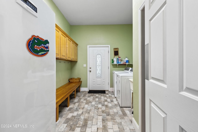 mudroom with washing machine and clothes dryer