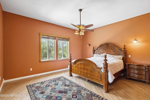 bedroom featuring ceiling fan and light hardwood / wood-style flooring