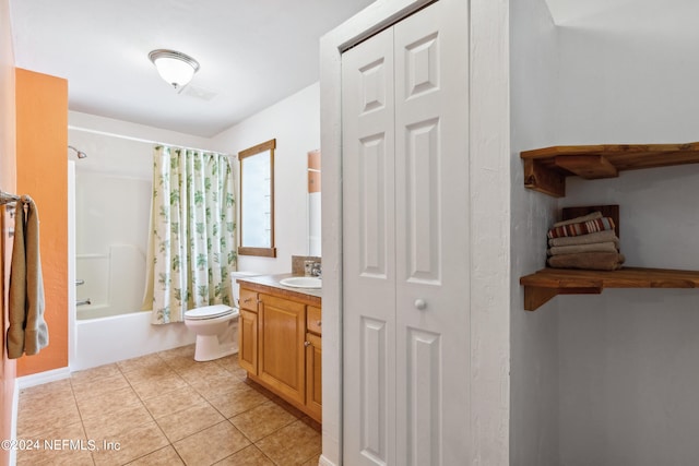 full bathroom with toilet, tile patterned floors, shower / tub combo, and vanity