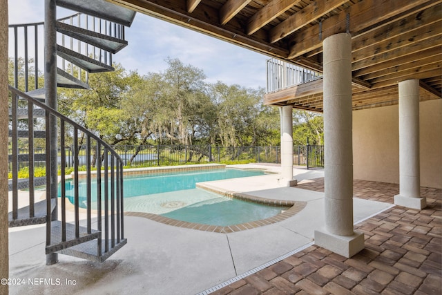 view of swimming pool with a patio area