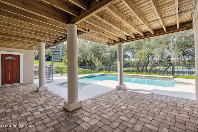 view of patio featuring a fenced in pool