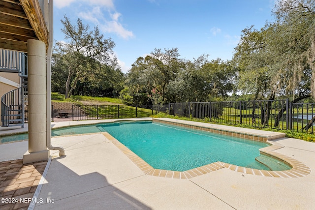 view of pool featuring a patio