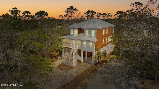 49 SW 279th Ave, Steinhatchee, FL 32359 - view of front of house with stairs and metal roof