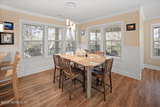 49 SW 279th Ave, Steinhatchee, FL 32359 - dining room featuring a wainscoted wall, crown molding, a chandelier, and wood finished floors