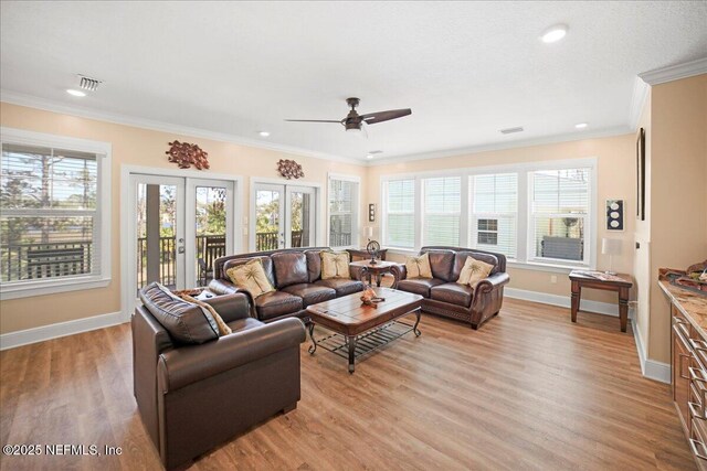 49 SW 279th Ave, Steinhatchee, FL 32359 - living area with baseboards, ornamental molding, visible vents, and light wood finished floors