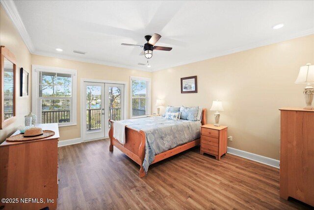 49 SW 279th Ave, Steinhatchee, FL 32359 - bedroom featuring crown molding, baseboards, access to outside, visible vents, and wood finished floors