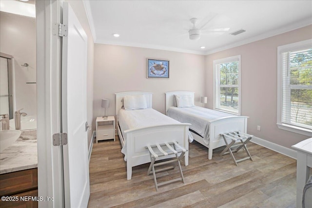 49 SW 279th Ave, Steinhatchee, FL 32359 - bedroom with baseboards, light wood-type flooring, recessed lighting, and crown molding