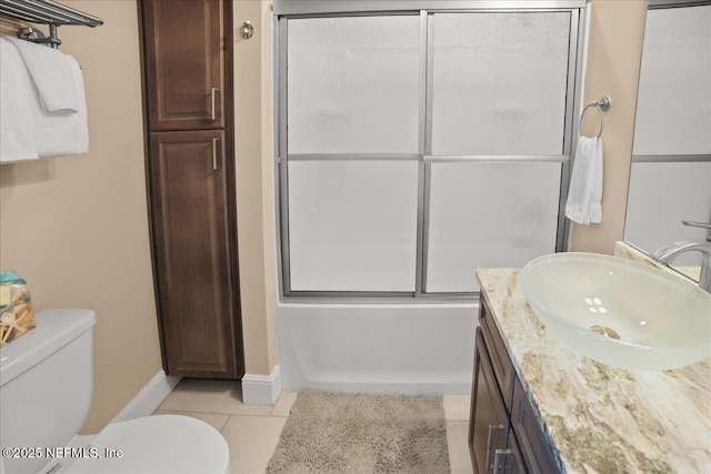 49 SW 279th Ave, Steinhatchee, FL 32359 - full bath with baseboards, toilet, tile patterned floors, vanity, and shower / bath combination with glass door