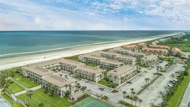 drone / aerial view featuring a view of the beach and a water view