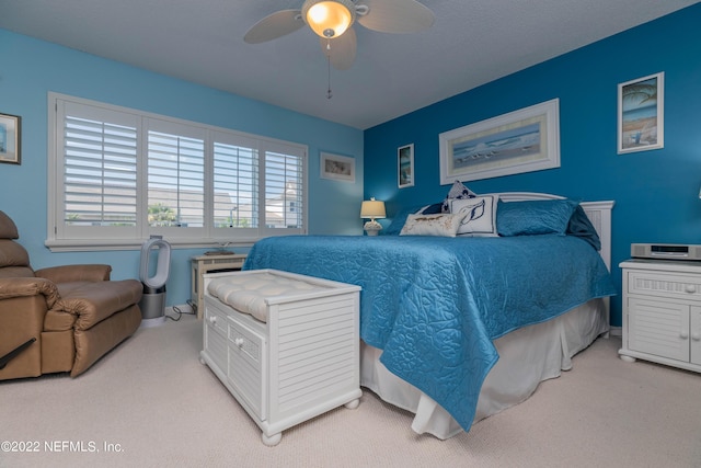 bedroom with light colored carpet and ceiling fan