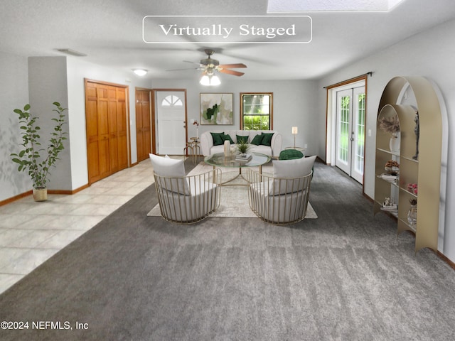 living room with carpet and ceiling fan