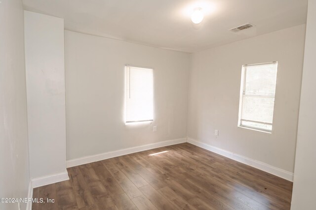 empty room featuring dark hardwood / wood-style floors