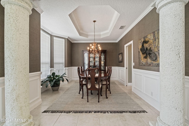 dining room featuring a textured ceiling, light tile patterned flooring, visible vents, and an inviting chandelier