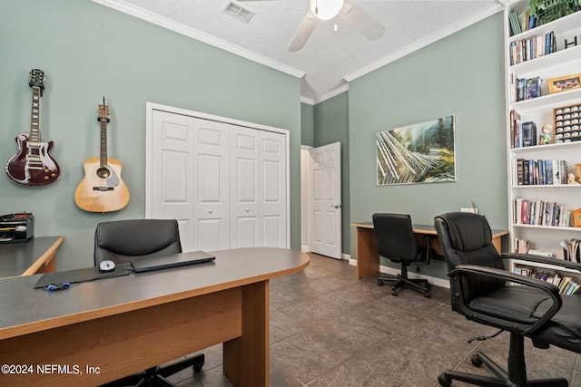 office space with a textured ceiling, ceiling fan, visible vents, baseboards, and crown molding