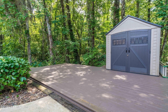 view of shed featuring a forest view