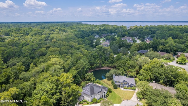 aerial view featuring a water view and a wooded view