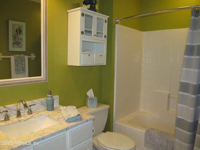 bathroom with shower / bath combo, vanity, and toilet