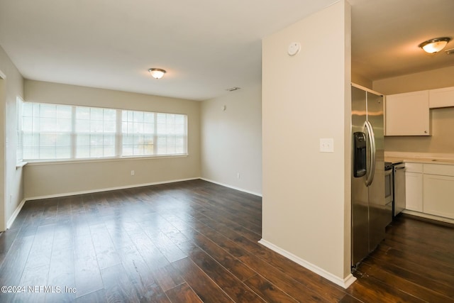 kitchen with white cabinetry, dark hardwood / wood-style floors, and stainless steel fridge with ice dispenser