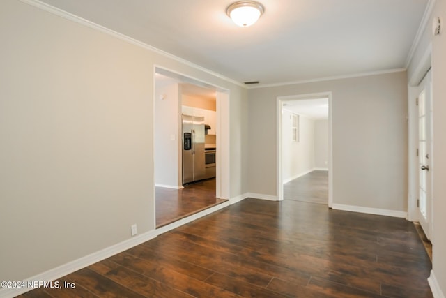 unfurnished room featuring crown molding and dark hardwood / wood-style floors