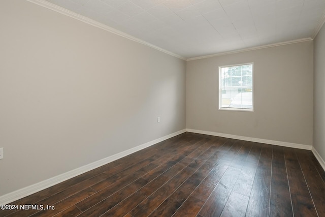 spare room with dark wood-type flooring and crown molding