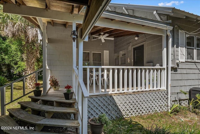 exterior space featuring ceiling fan