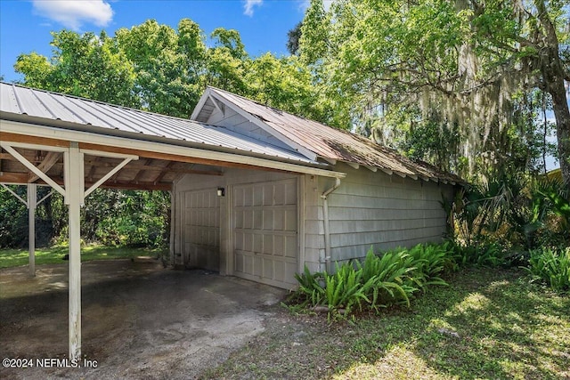 view of outdoor structure with a carport