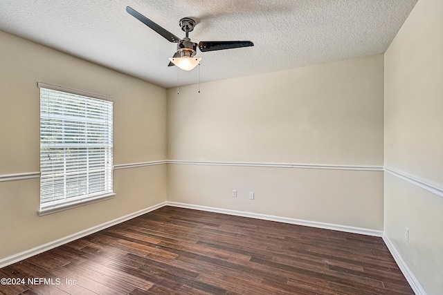 spare room with baseboards, a textured ceiling, a ceiling fan, and wood finished floors