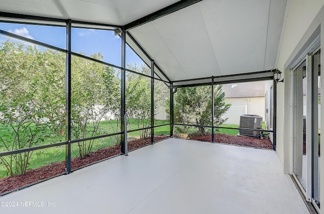 unfurnished sunroom featuring lofted ceiling