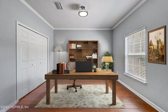 office area with dark hardwood / wood-style flooring, a textured ceiling, and crown molding