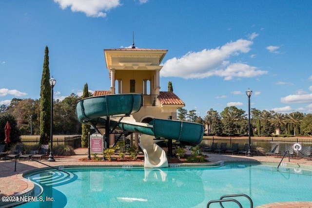 view of swimming pool featuring a water slide