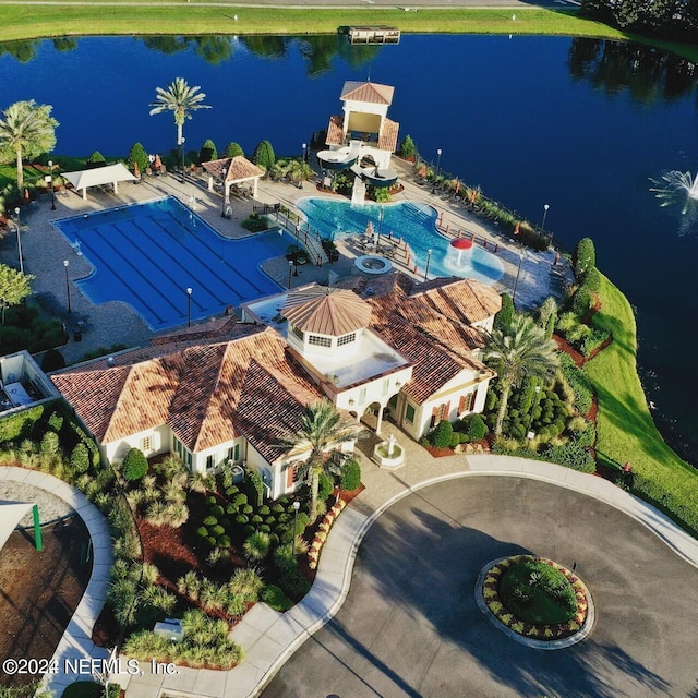 birds eye view of property with a water view