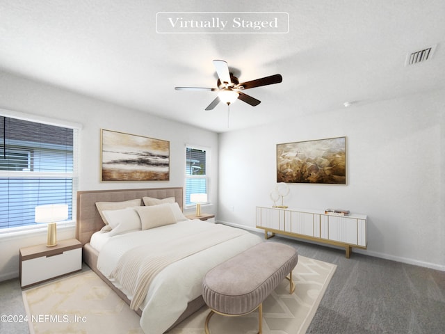 carpeted bedroom featuring ceiling fan