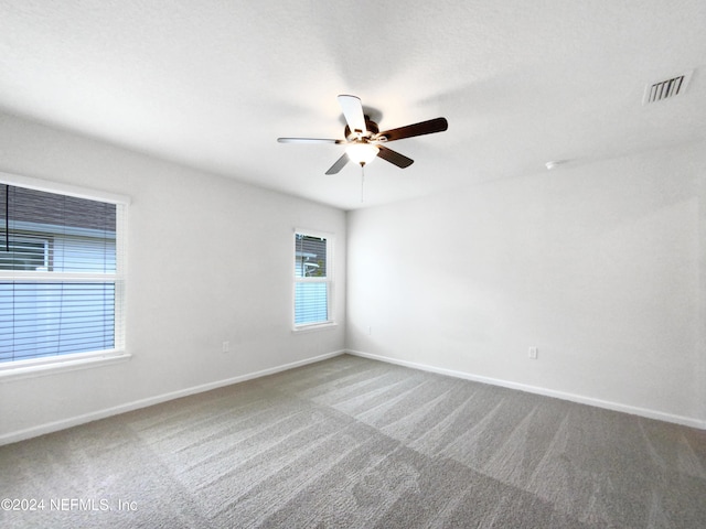 unfurnished room featuring carpet floors and ceiling fan