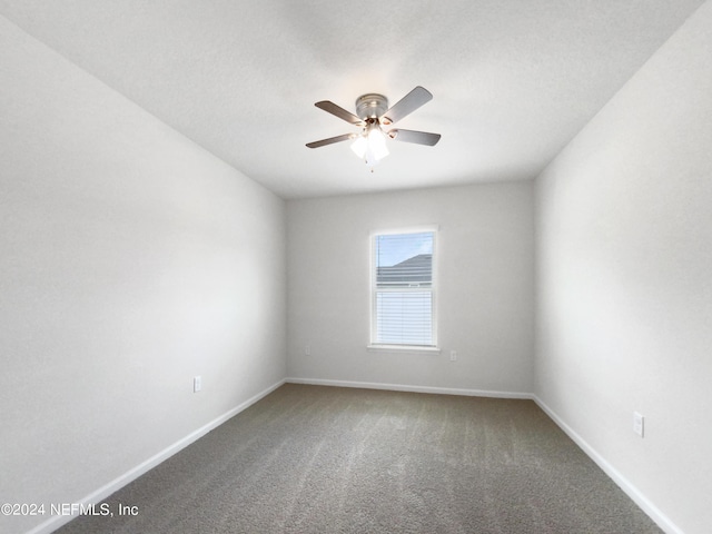 empty room featuring ceiling fan and carpet floors