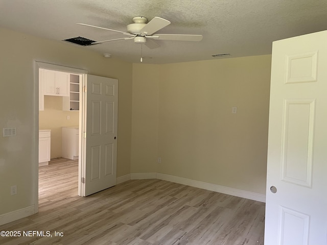 1058 W 17th St, Jacksonville, FL 32209 - spare room featuring baseboards, a ceiling fan, light wood-type flooring, and visible vents