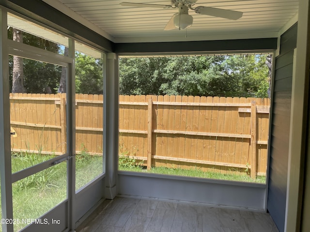 1058 W 17th St, Jacksonville, FL 32209 - unfurnished sunroom featuring a ceiling fan
