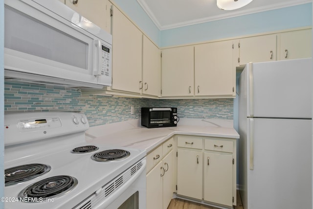 kitchen featuring backsplash, light stone countertops, a toaster, ornamental molding, and white appliances