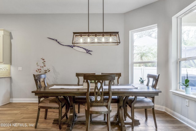 dining area with hardwood / wood-style flooring