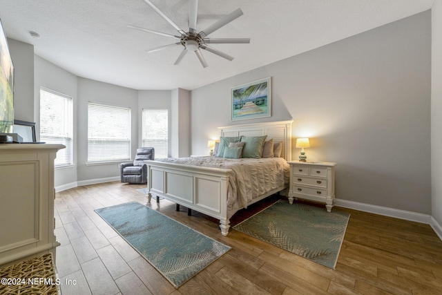 bedroom with light wood-type flooring and ceiling fan