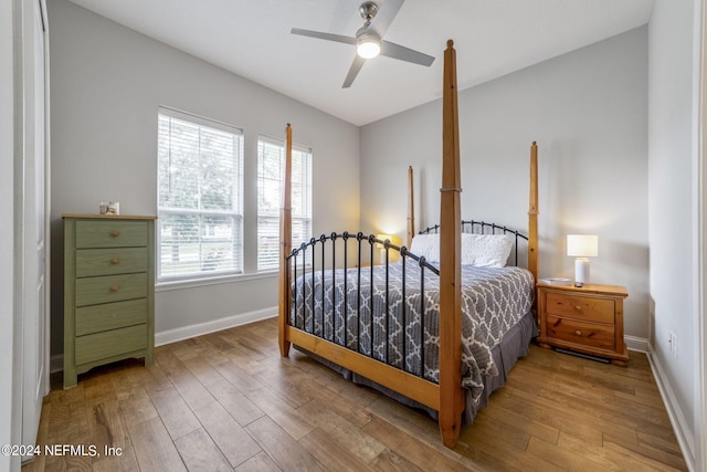 bedroom featuring hardwood / wood-style flooring and ceiling fan